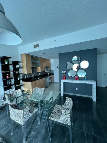 a view of entryway with stairs and wooden floor