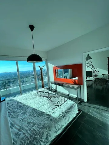 a room with pool table and chairs