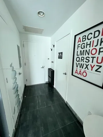 a view of entryway with stairs and wooden floor