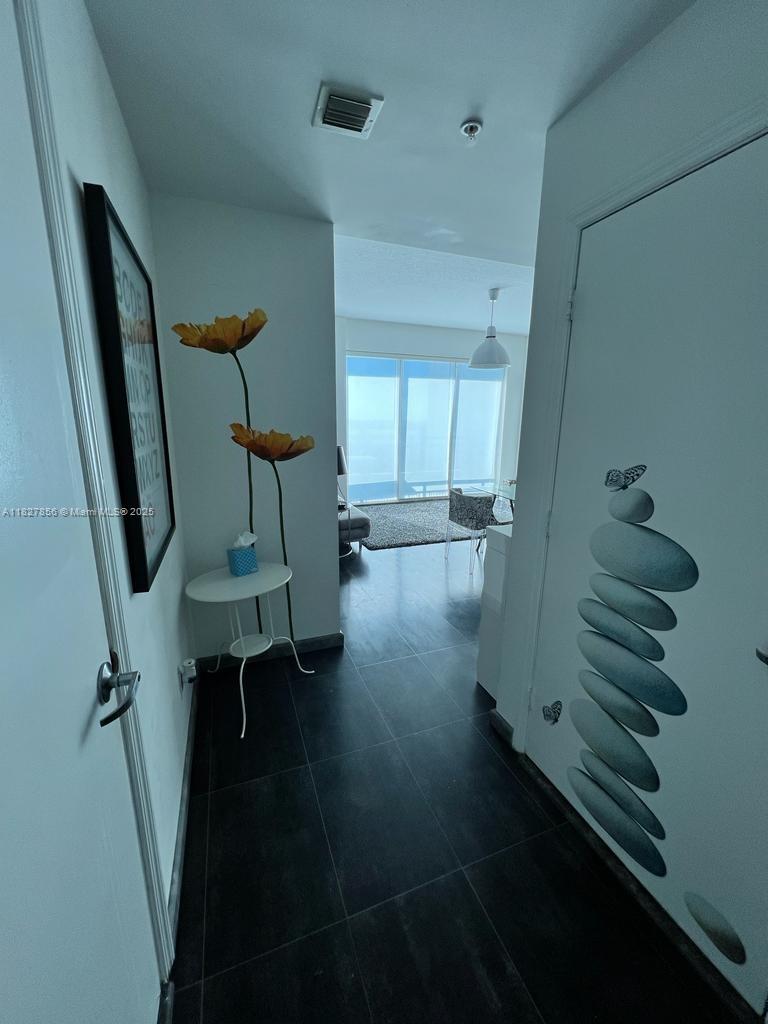 60 Southwest 13th Street, Unit 3407 Miami, FL 33130 - Photo 23 of 24 a view of entryway with stairs and wooden floor