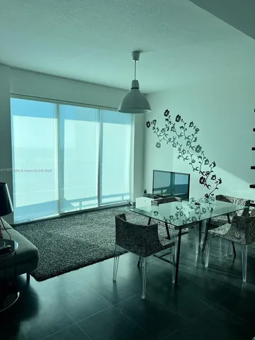 a workspace with furniture and a chandelier