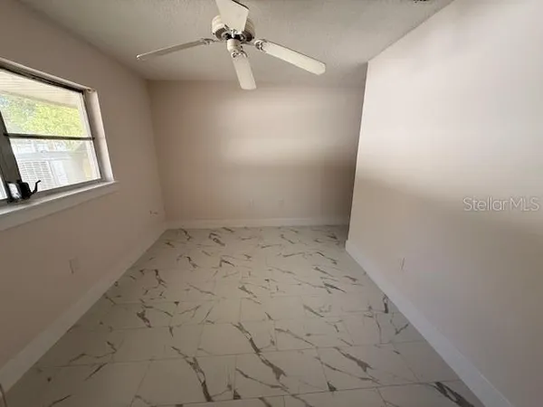 an empty room with windows