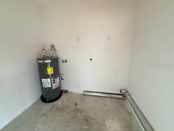a view of a storage & utility room with a window