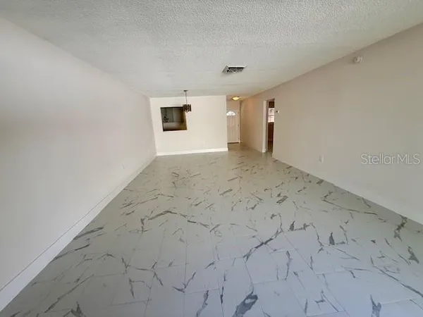 an empty room with natural light