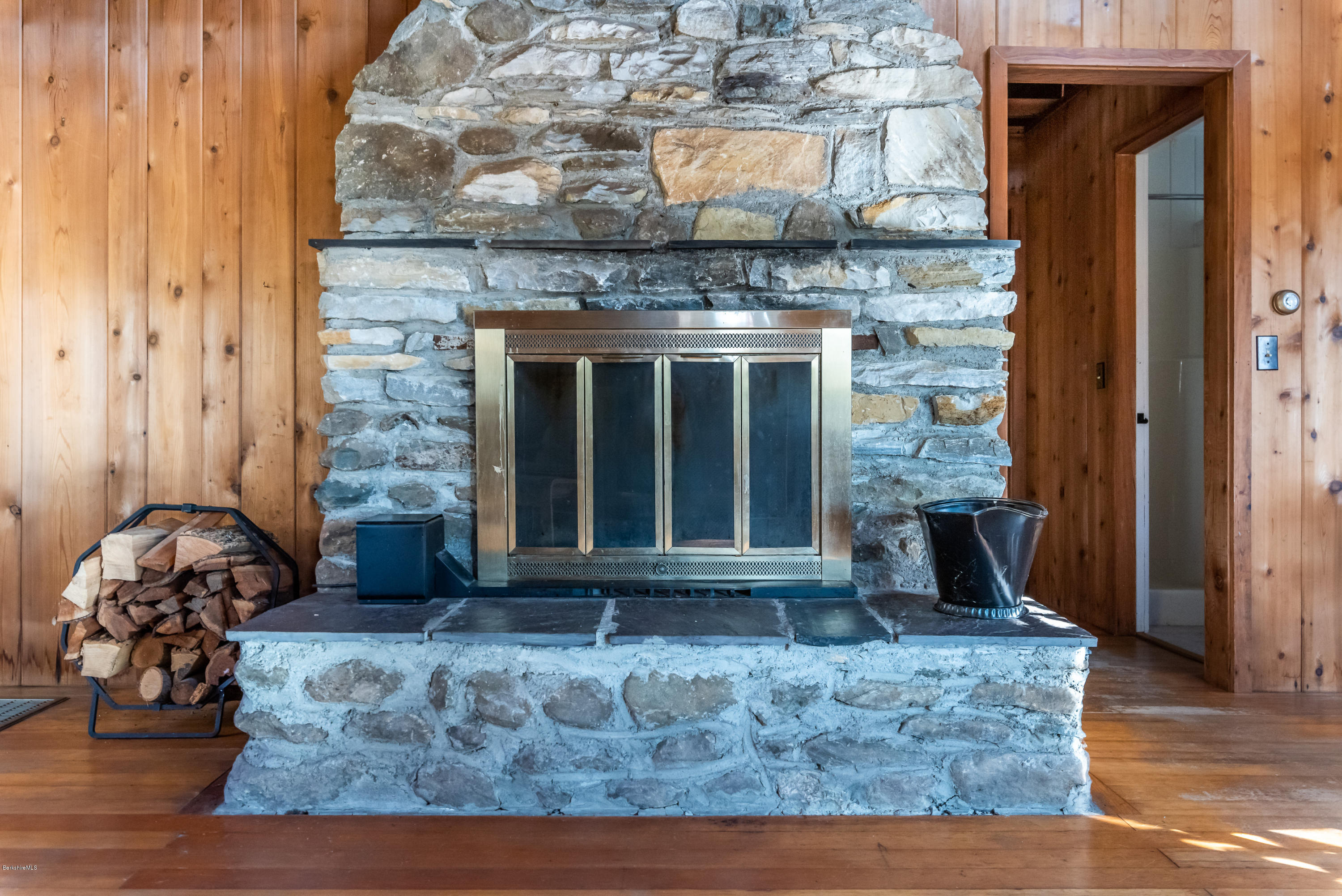 10 Housatonnuck Road Stockbridge, MA 01262 - Photo 13 of 30 a living room with fireplace furniture and a wooden floor