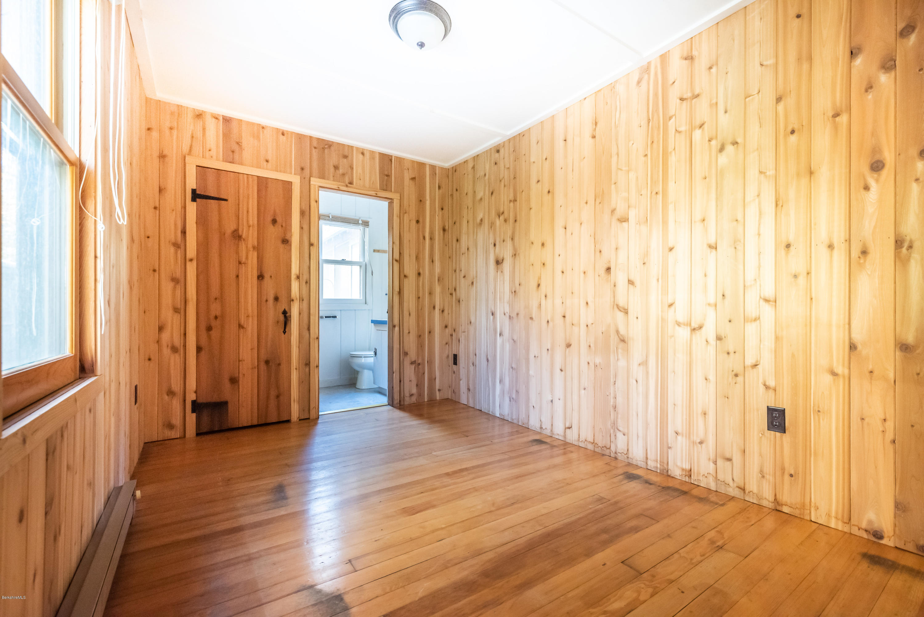 10 Housatonnuck Road Stockbridge, MA 01262 - Photo 18 of 30 a view of a hallway with wooden floor and staircase