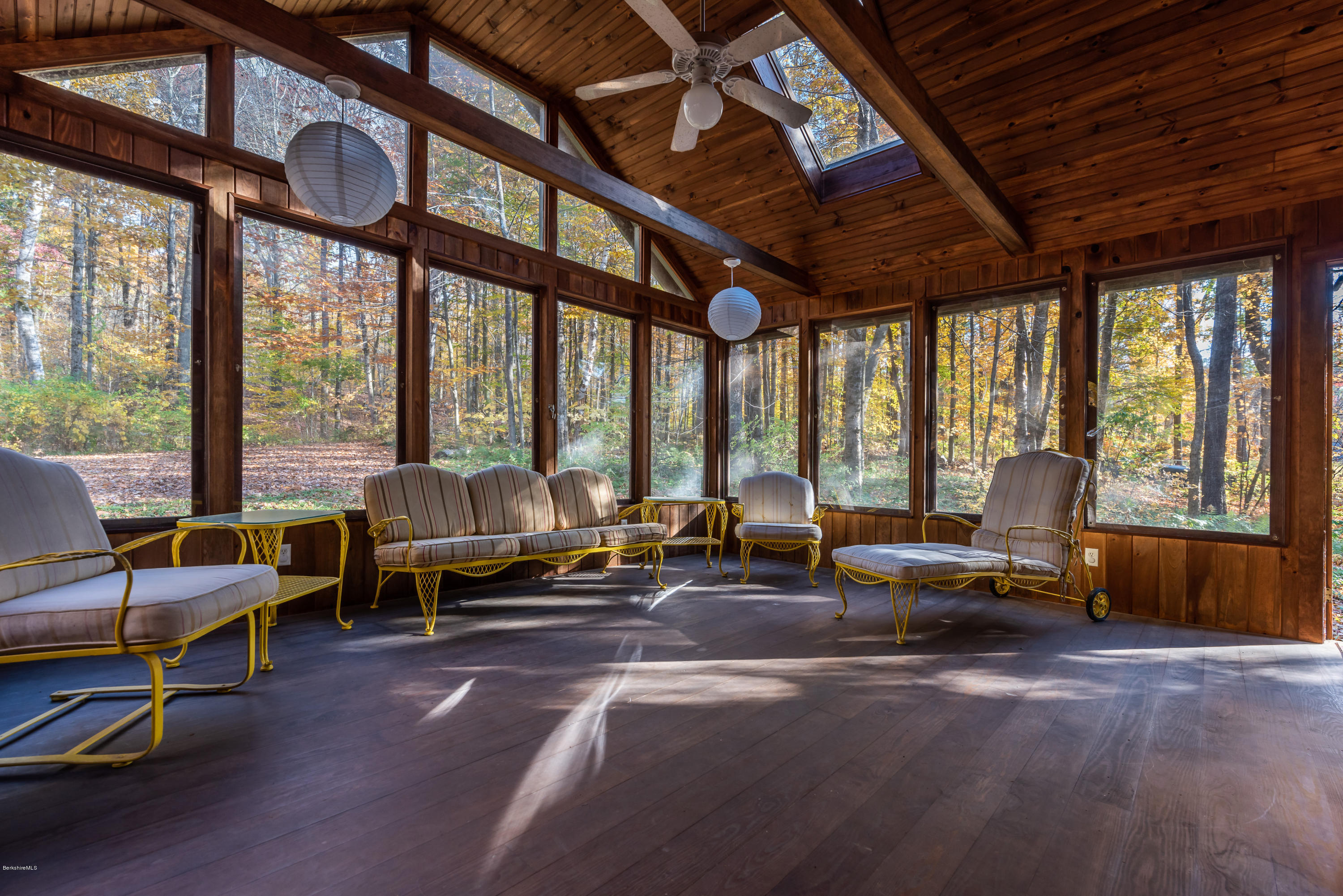 10 Housatonnuck Road Stockbridge, MA 01262 - Photo 4 of 30 a living room with furniture and floor to ceiling windows