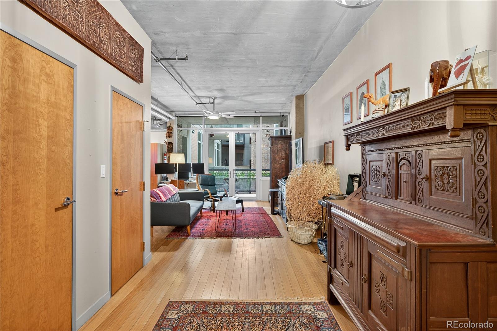 1401 Wewatta Street, Unit 305 Denver, CO 80202 - Photo 28 of 45 a view of living room with furniture and a fireplace