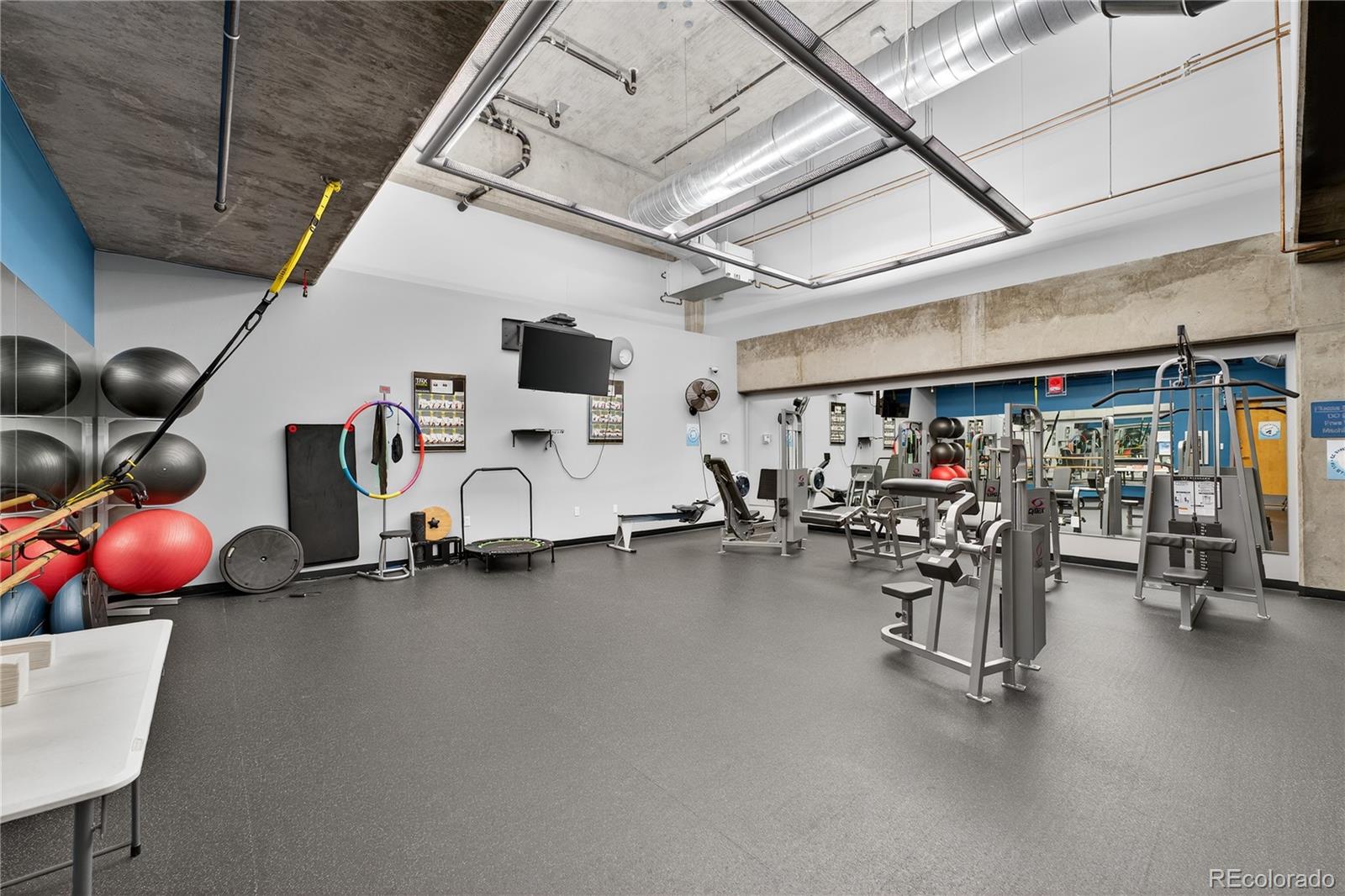 1401 Wewatta Street, Unit 305 Denver, CO 80202 - Photo 32 of 45 a room with gym equipment
