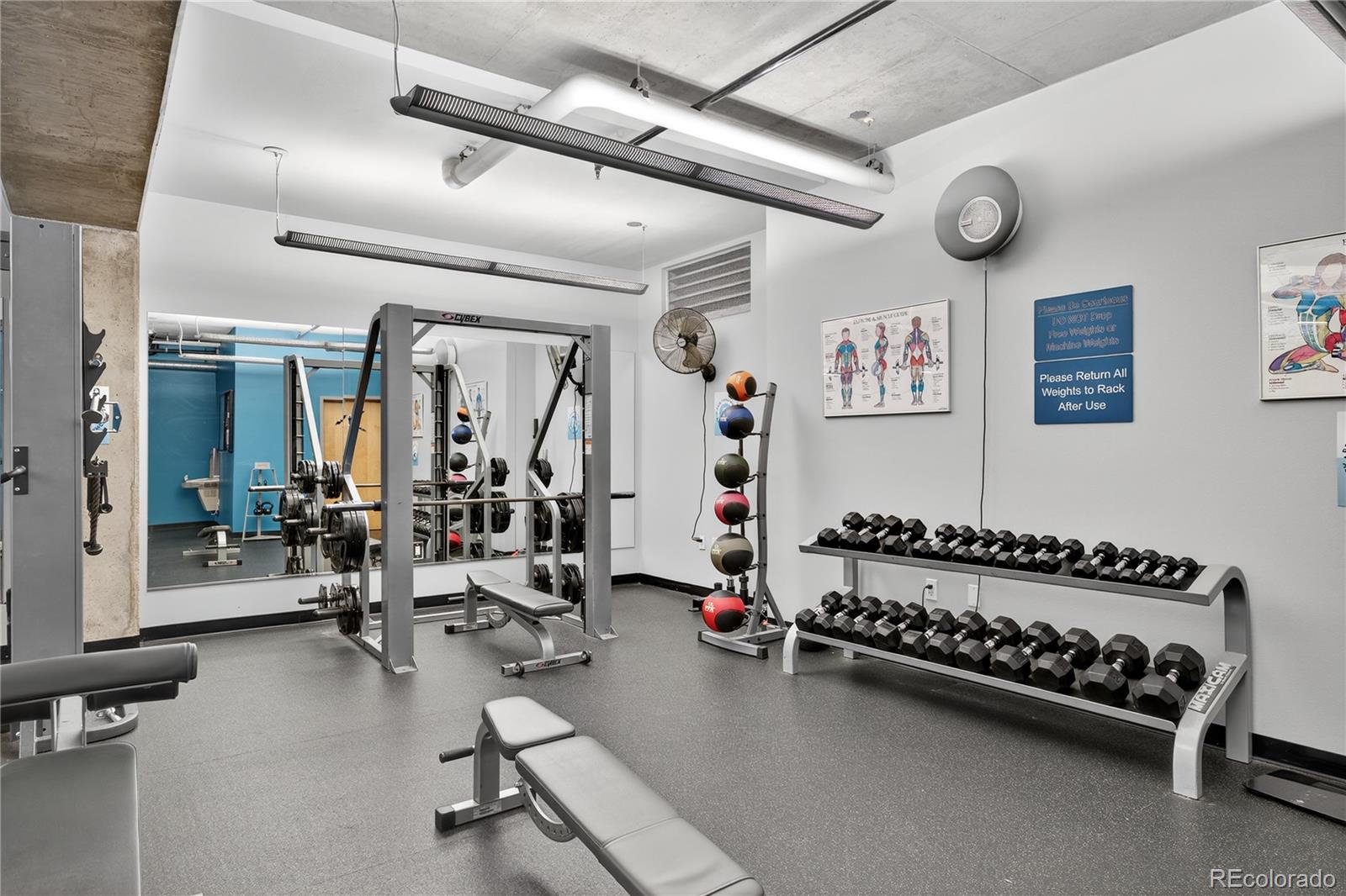 1401 Wewatta Street, Unit 305 Denver, CO 80202 - Photo 35 of 45 a gym room with lots of gym equipment