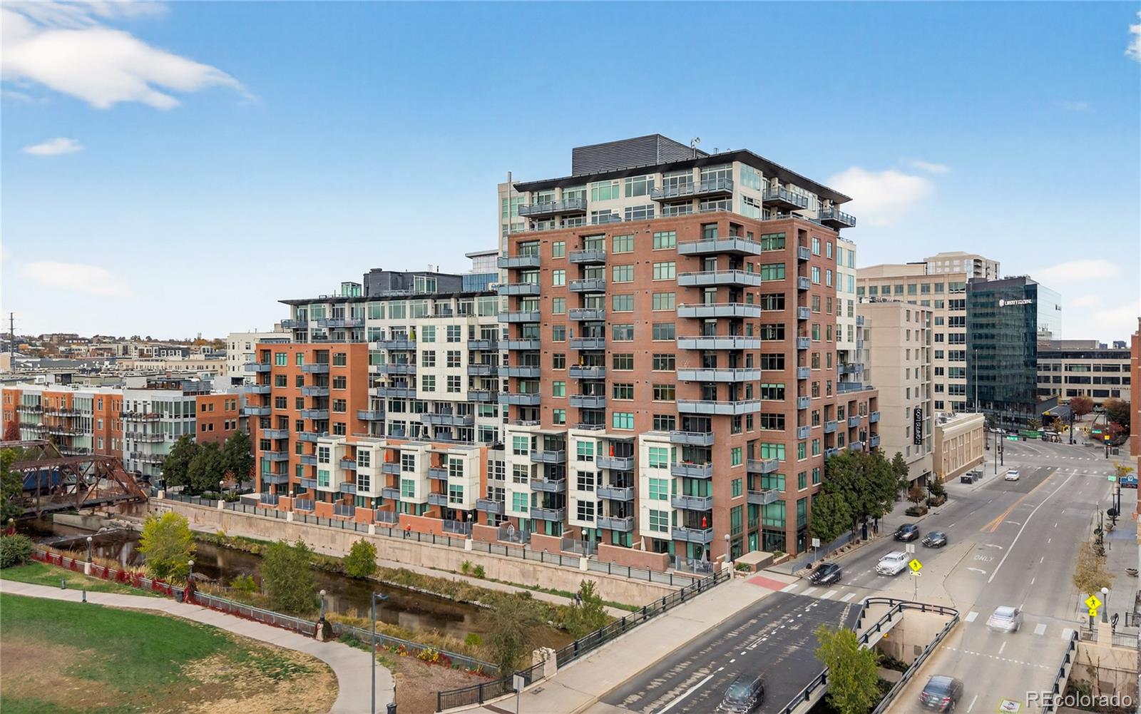 1401 Wewatta Street, Unit 305 Denver, CO 80202 - Photo 4 of 45 a view of a tall building from a balcony