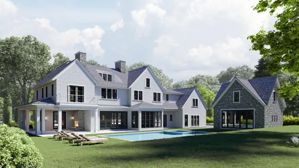 a front view of a house with a garden and plants