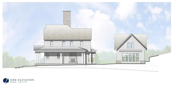 a white house with a large window and parking space