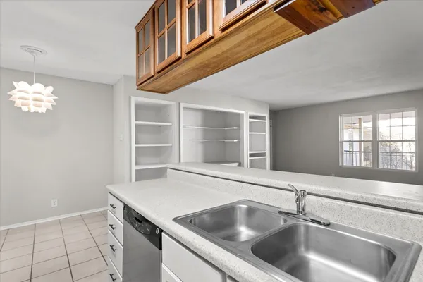 a kitchen with a sink and a window