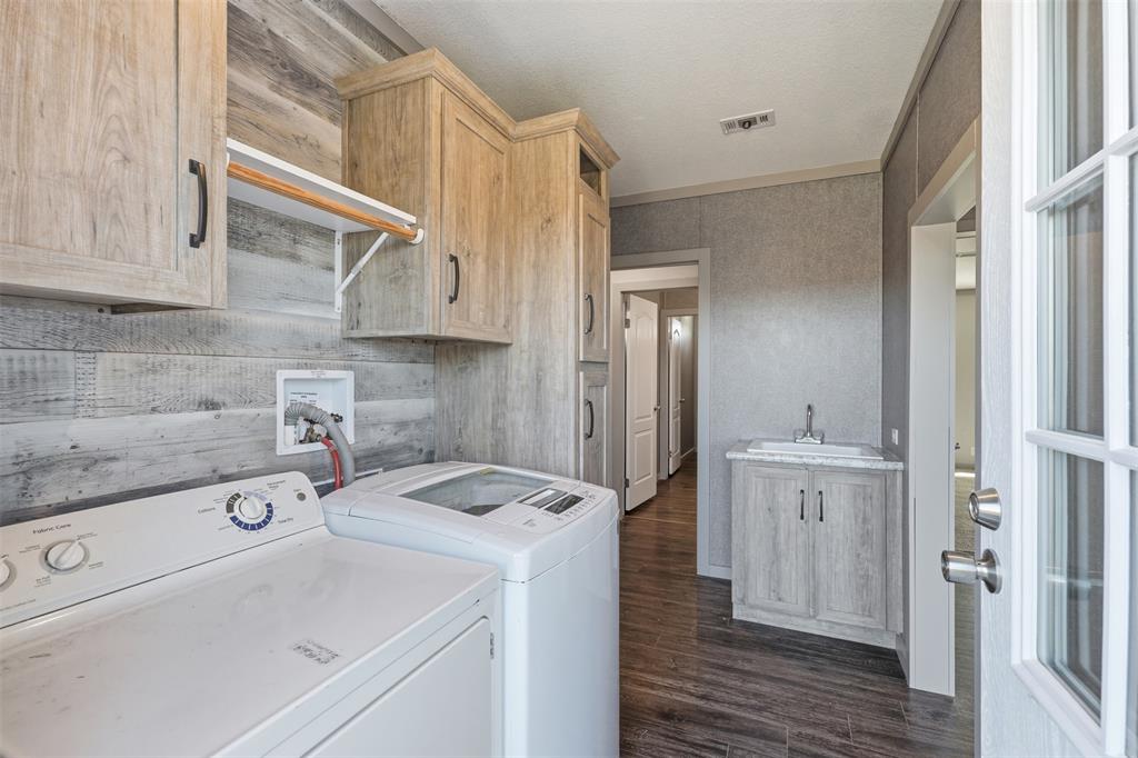 151 Private Road 3814 Springtown, TX 76082 - Photo 12 of 29 a view of a kitchen with white cabinets