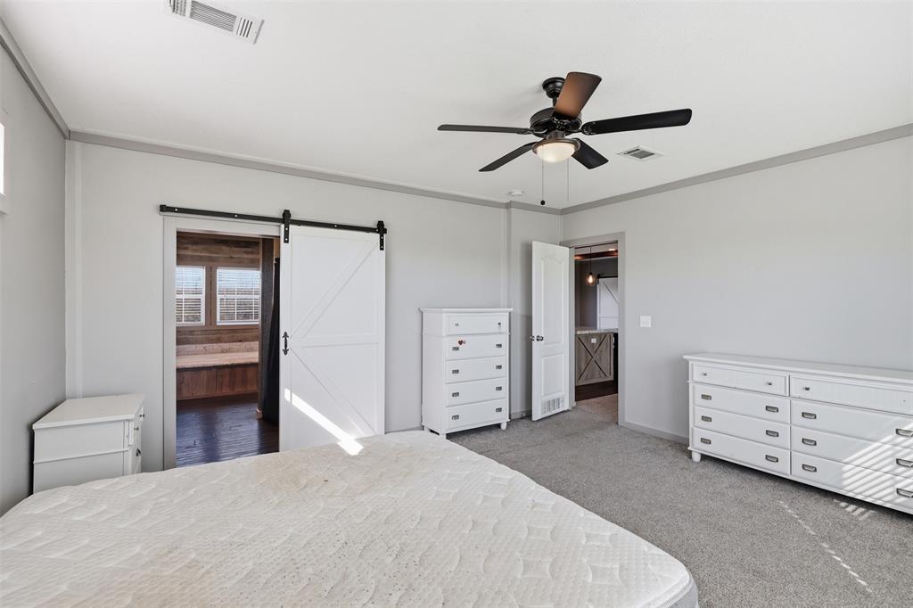 151 Private Road 3814 Springtown, TX 76082 - Photo 15 of 29 a bedroom with a bed and a window