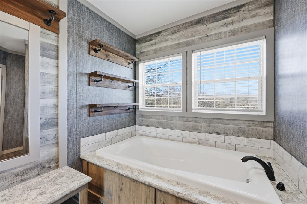 151 Private Road 3814 Springtown, TX 76082 - Photo 17 of 29 a bath tub sitting next to a window