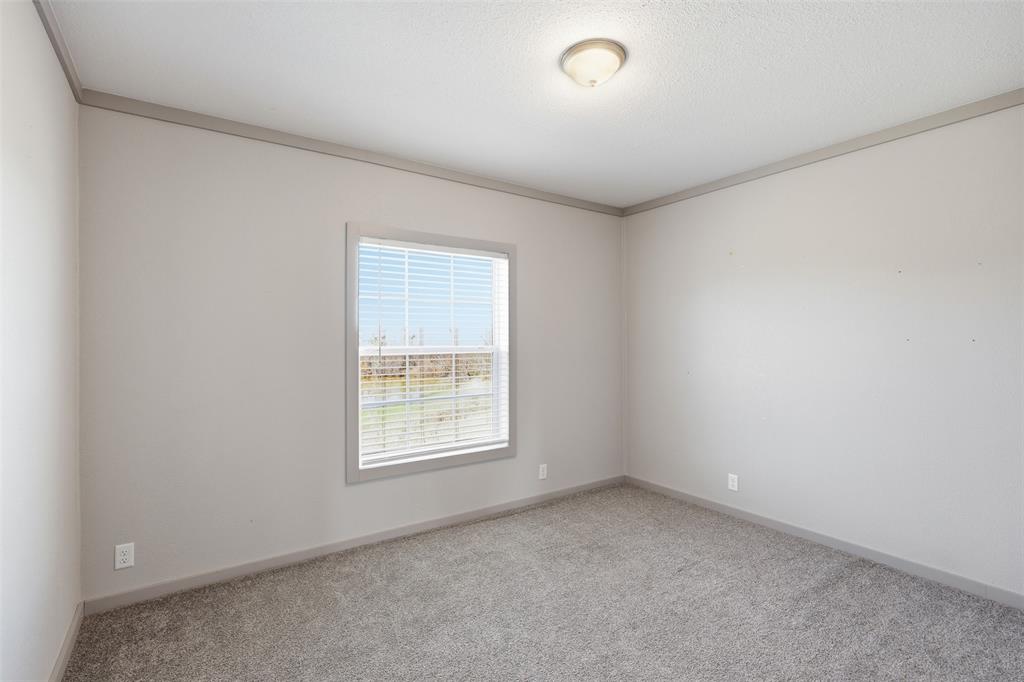 151 Private Road 3814 Springtown, TX 76082 - Photo 19 of 29 an empty room with a window