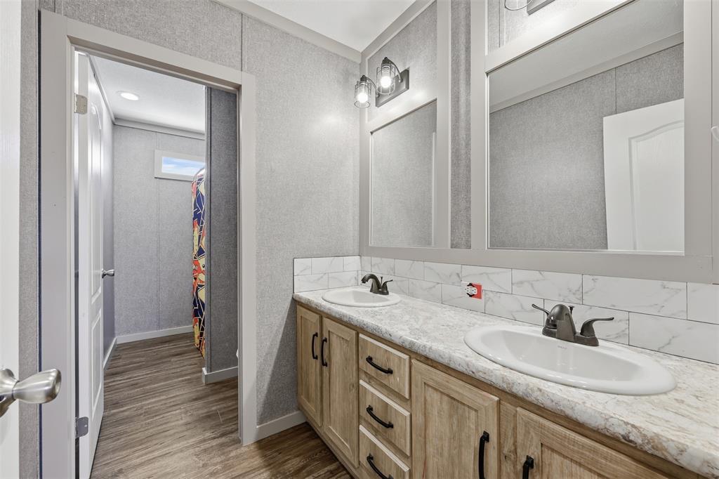 151 Private Road 3814 Springtown, TX 76082 - Photo 20 of 29 a bathroom with a double vanity sink and a mirror