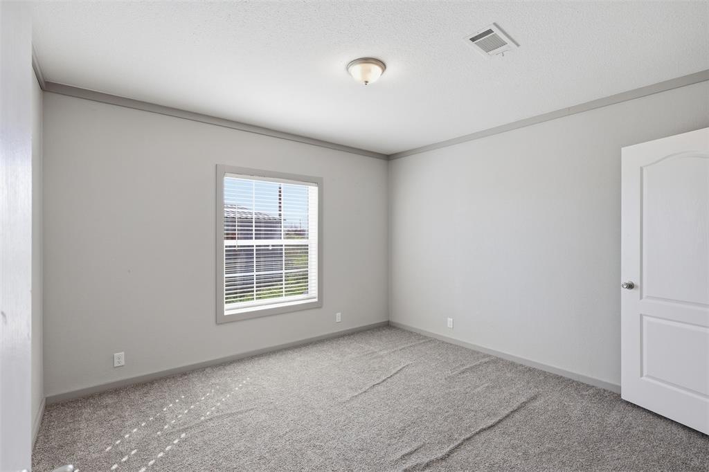 151 Private Road 3814 Springtown, TX 76082 - Photo 23 of 29 a view of an empty room with a window