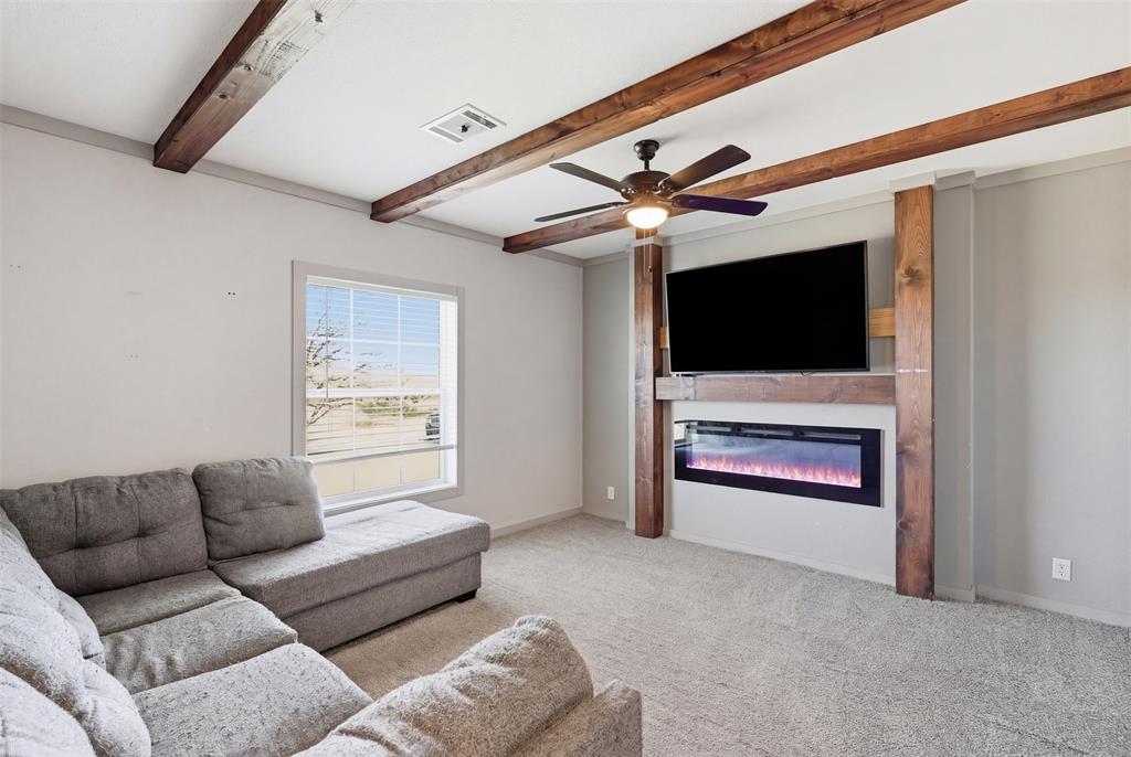 151 Private Road 3814 Springtown, TX 76082 - Photo 24 of 29 a living room with furniture and a flat screen tv