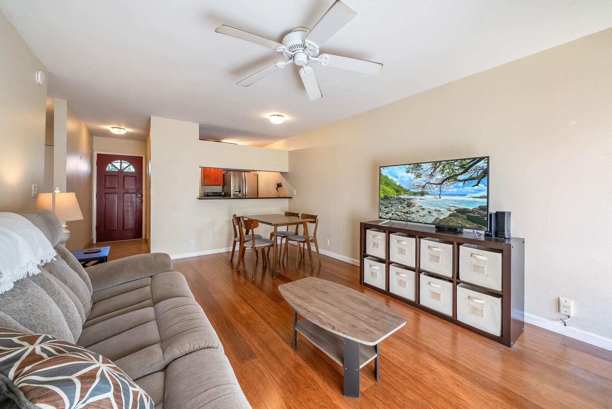 480 Kenolio Road, Unit 6204 Kihei, HI 96753 - Photo 1 of 44 a living room with furniture and a flat screen tv