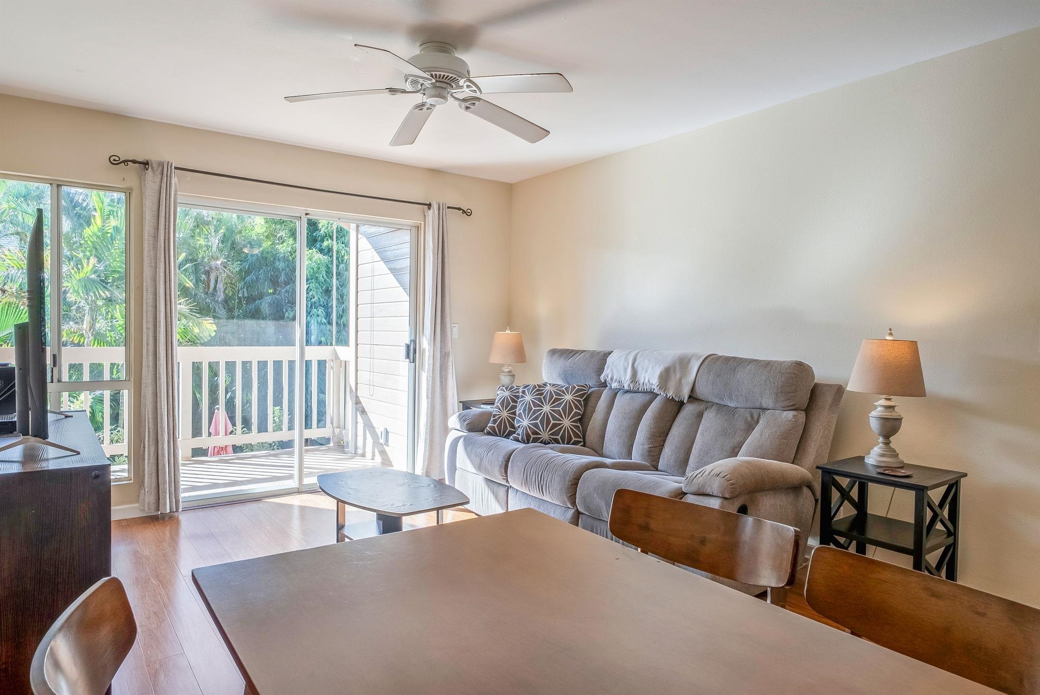 480 Kenolio Road, Unit 6204 Kihei, HI 96753 - Photo 13 of 44 a living room with furniture and a large window