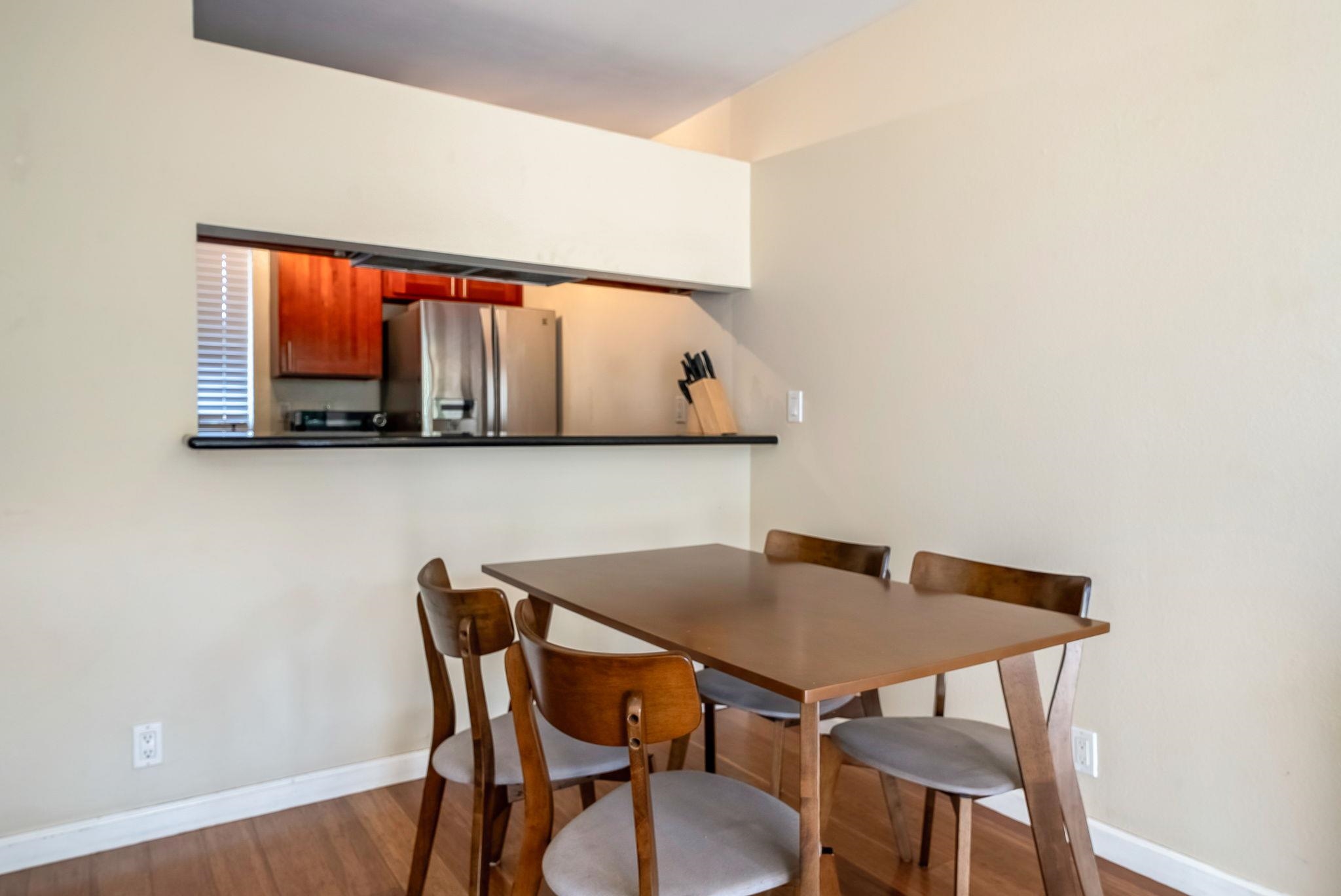 480 Kenolio Road, Unit 6204 Kihei, HI 96753 - Photo 16 of 44 a view of a dining room with furniture and window