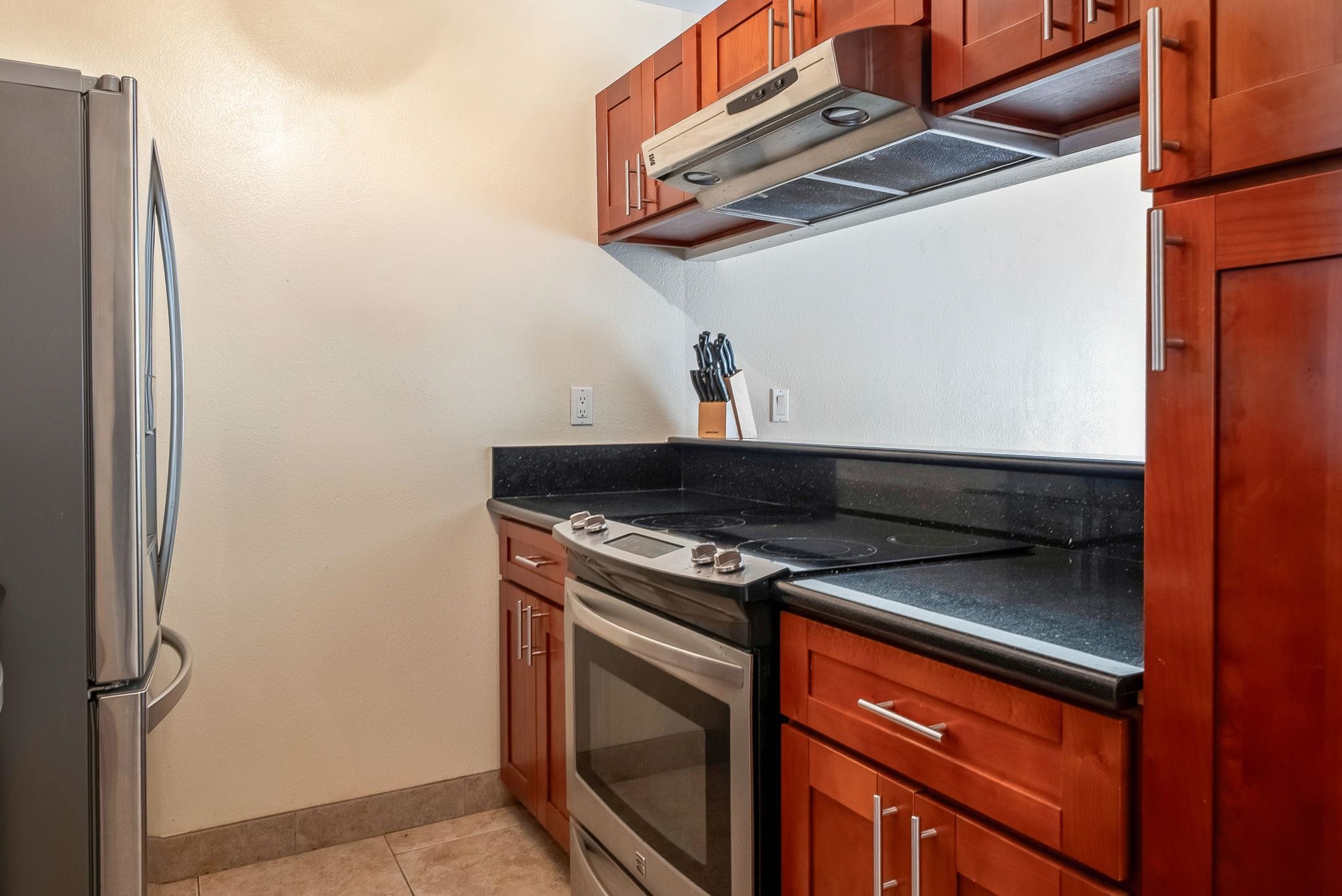 480 Kenolio Road, Unit 6204 Kihei, HI 96753 - Photo 18 of 44 a stove top oven sitting inside of a kitchen