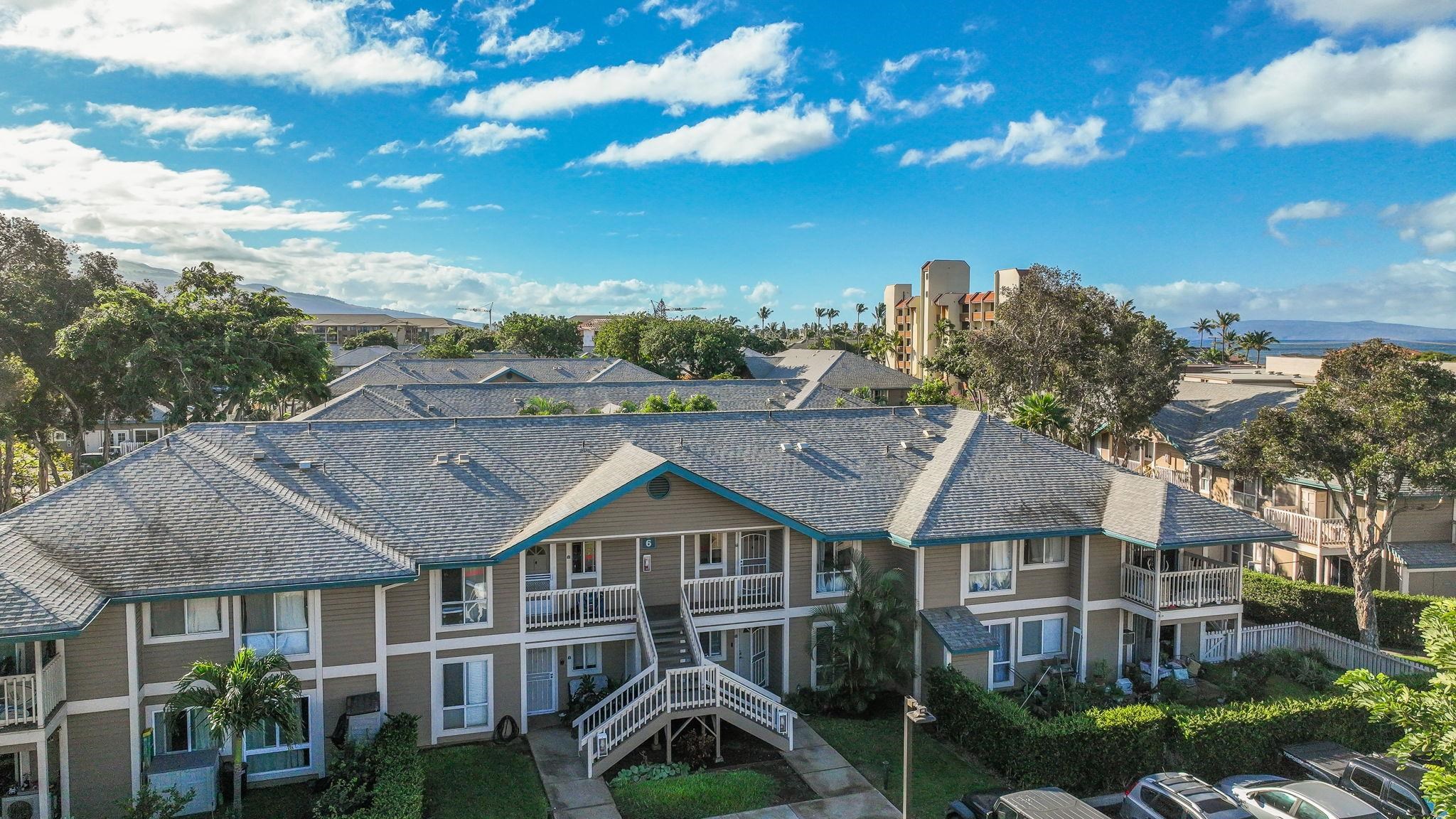 480 Kenolio Road, Unit 6204 Kihei, HI 96753 - Photo 7 of 44 a view of a big house with a big yard plants and large trees