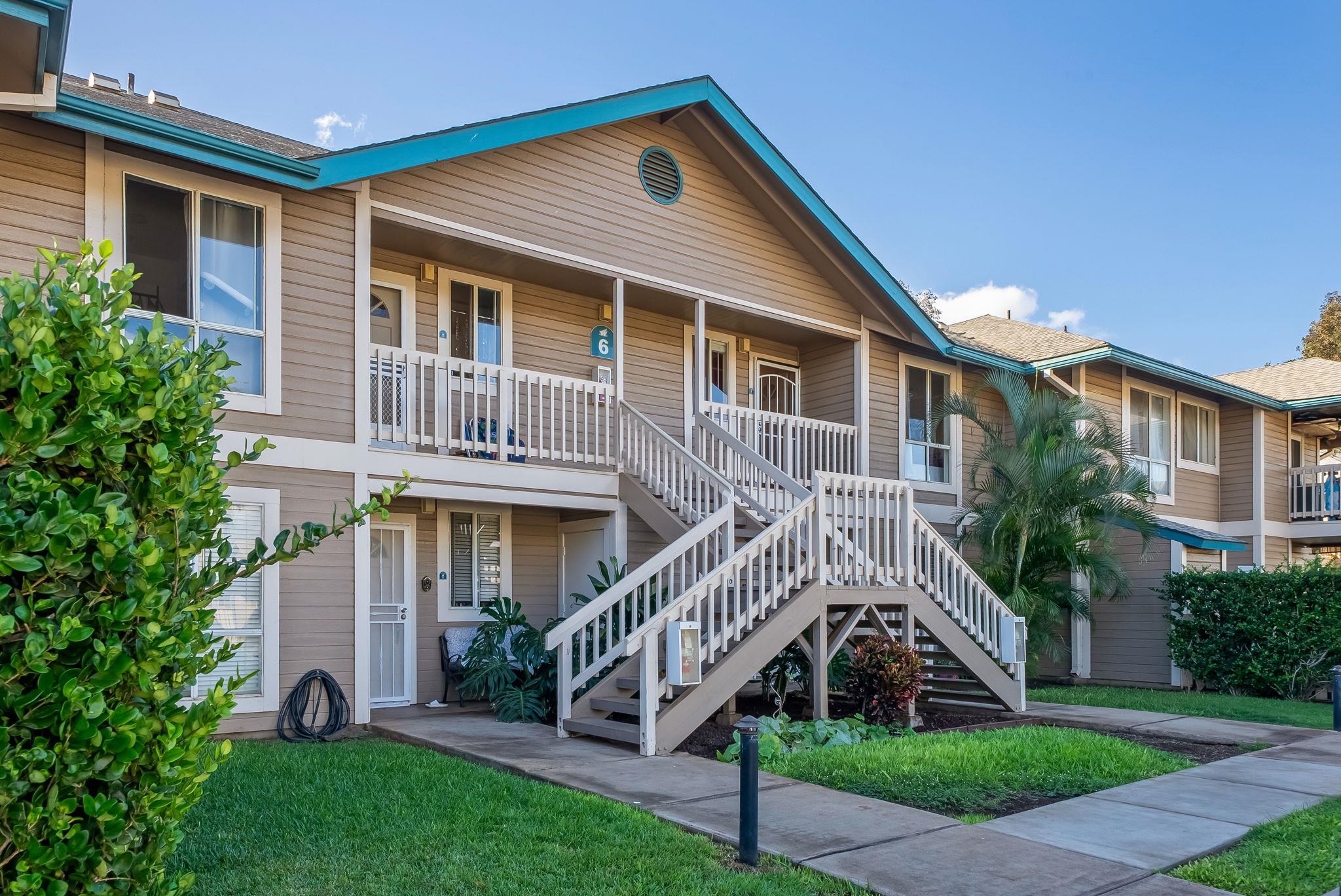 480 Kenolio Road, Unit 6204 Kihei, HI 96753 - Photo 10 of 44 a front view of a house with a yard and potted plants