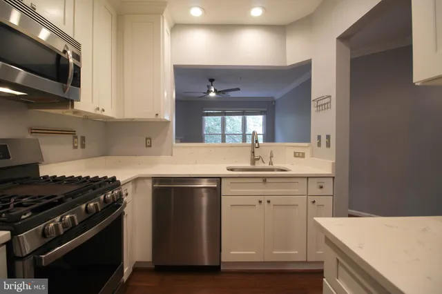 a kitchen with a stove and a sink
