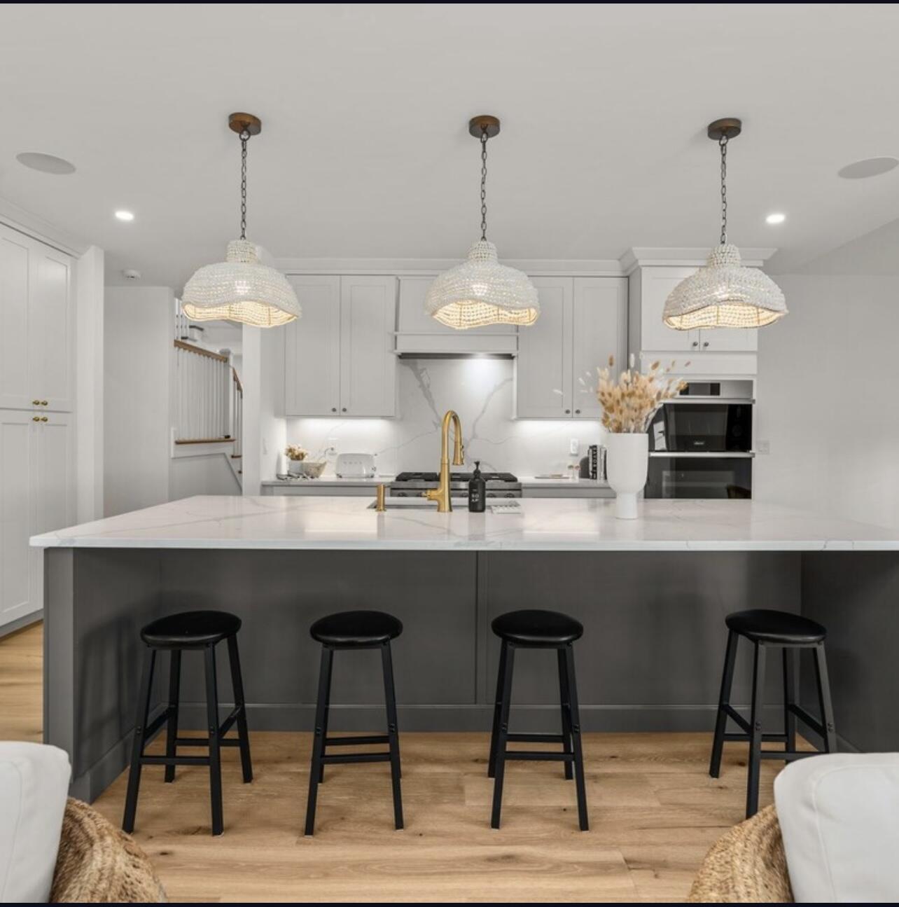 3 Azalea Lane Mashpee, MA 02649 - Photo 10 of 29 a kitchen with stainless steel appliances a dining table chairs and white cabinets