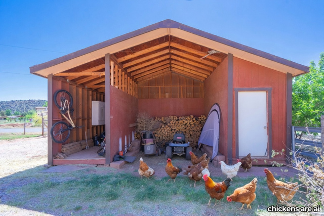 1504 Rome Way Apple Valley, UT 84737 - Photo 20 of 22 Red-painted outbuilding featuring a sloped roofline and exposed wood rafters
