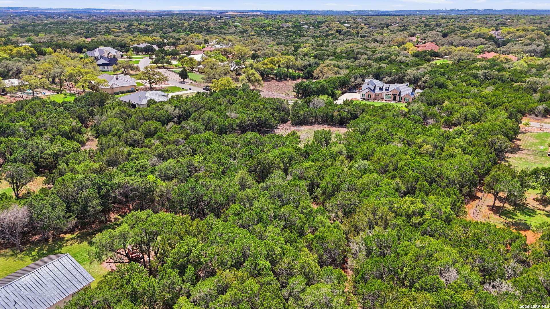 27230 Eichenbaum Road New Braunfels, TX 78132 - Photo 14 of 38 an aerial view of residential houses with outdoor space and trees