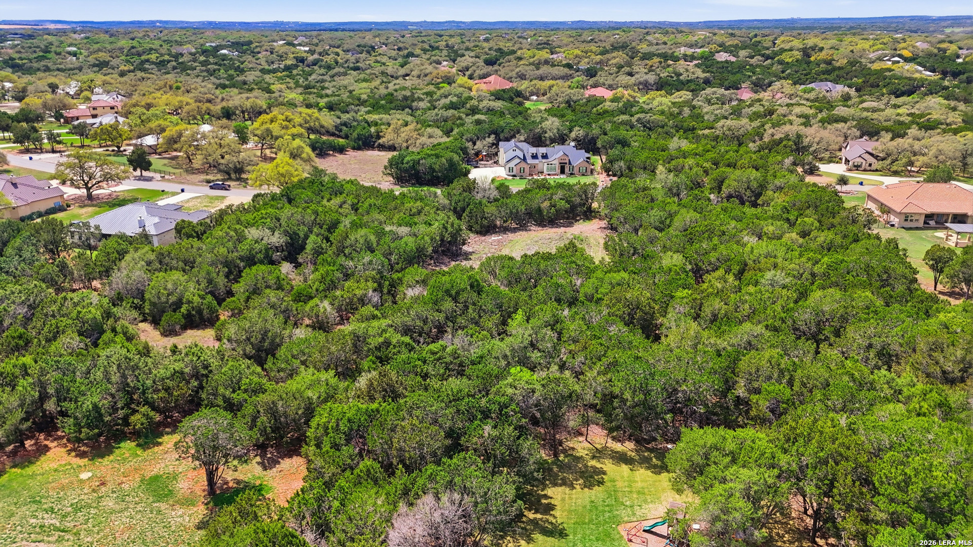 27230 Eichenbaum Road New Braunfels, TX 78132 - Photo 15 of 38 an aerial view of residential houses with outdoor space and trees
