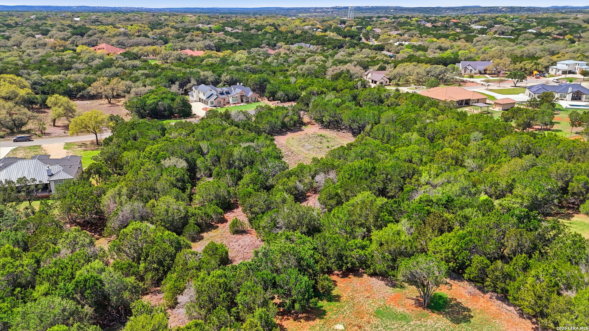27230 Eichenbaum Road New Braunfels, TX 78132 - Photo 16 of 38 an aerial view of residential houses with outdoor space and trees