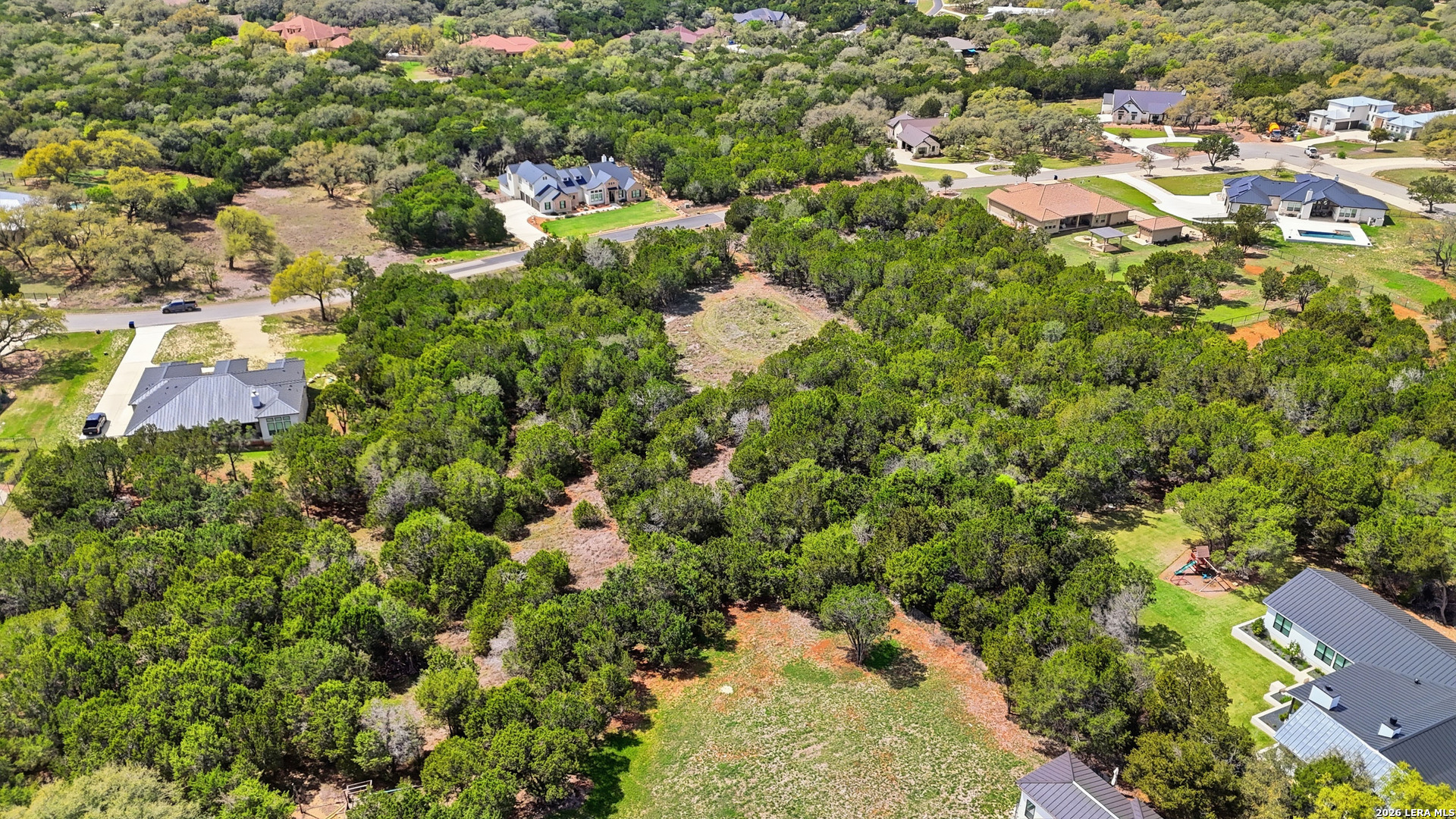 27230 Eichenbaum Road New Braunfels, TX 78132 - Photo 22 of 38 an aerial view of residential houses with outdoor space and trees