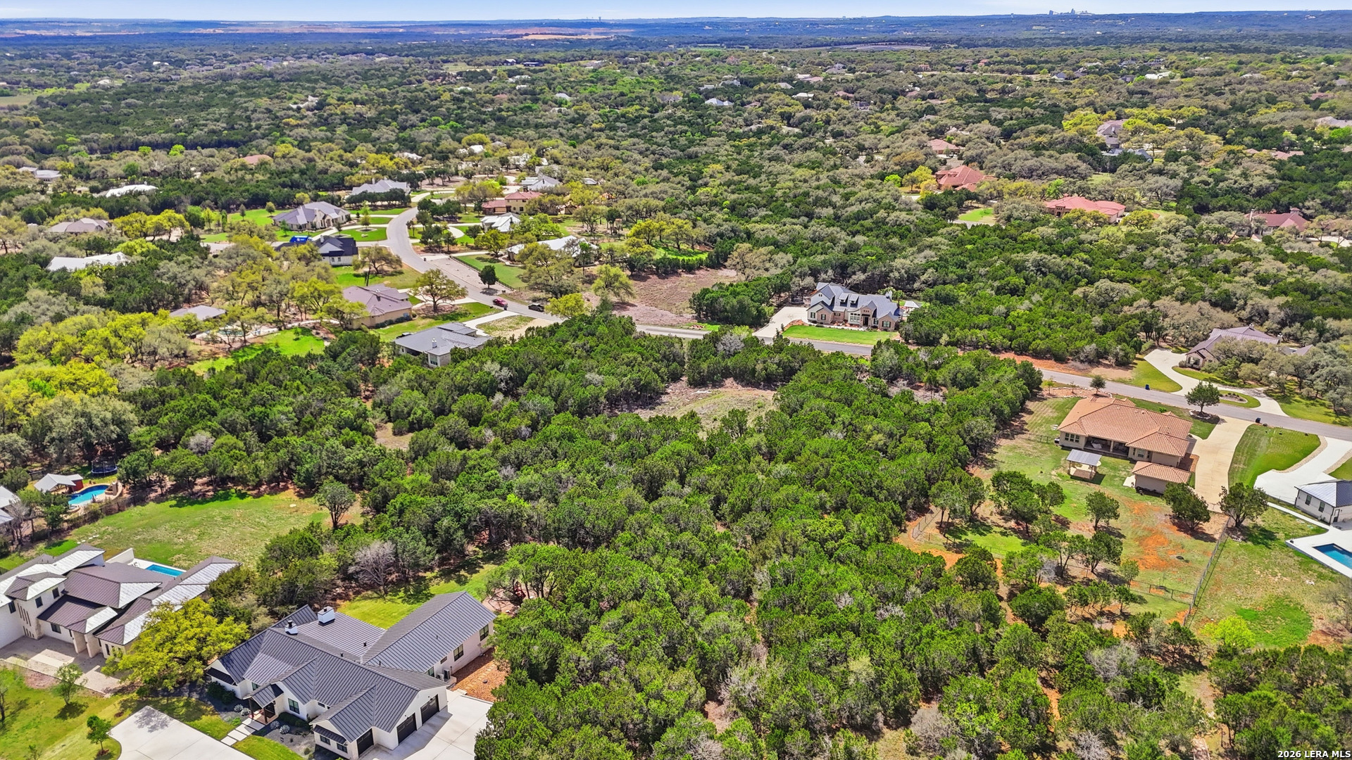 27230 Eichenbaum Road New Braunfels, TX 78132 - Photo 25 of 38 an aerial view of residential houses with outdoor space and street view