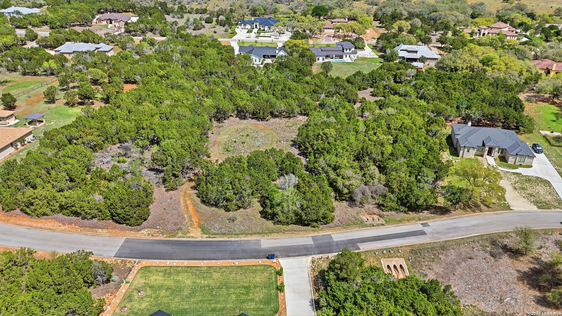 27230 Eichenbaum Road New Braunfels, TX 78132 - Photo 32 of 38 an aerial view of a house with a yard and large trees