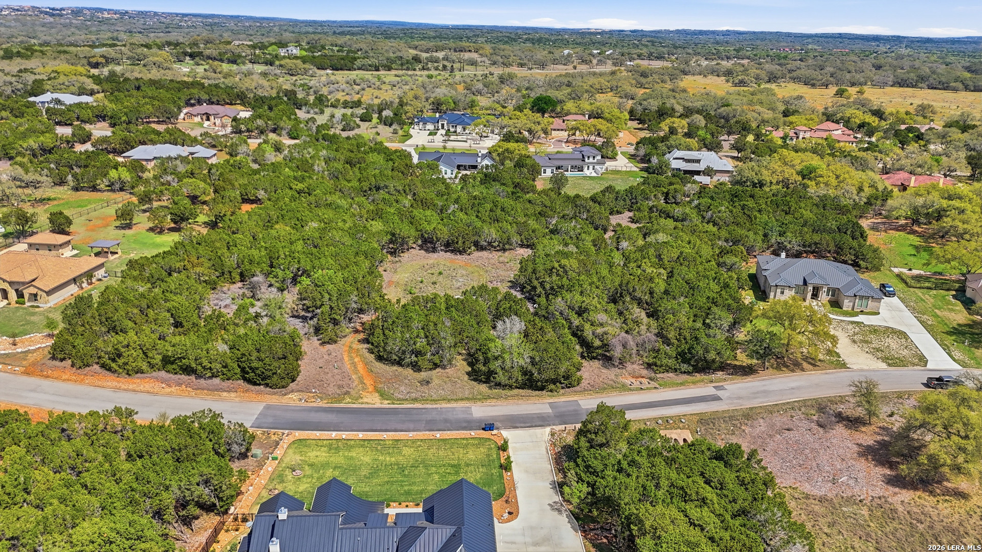 27230 Eichenbaum Road New Braunfels, TX 78132 - Photo 35 of 38 an aerial view of residential houses with outdoor space and trees