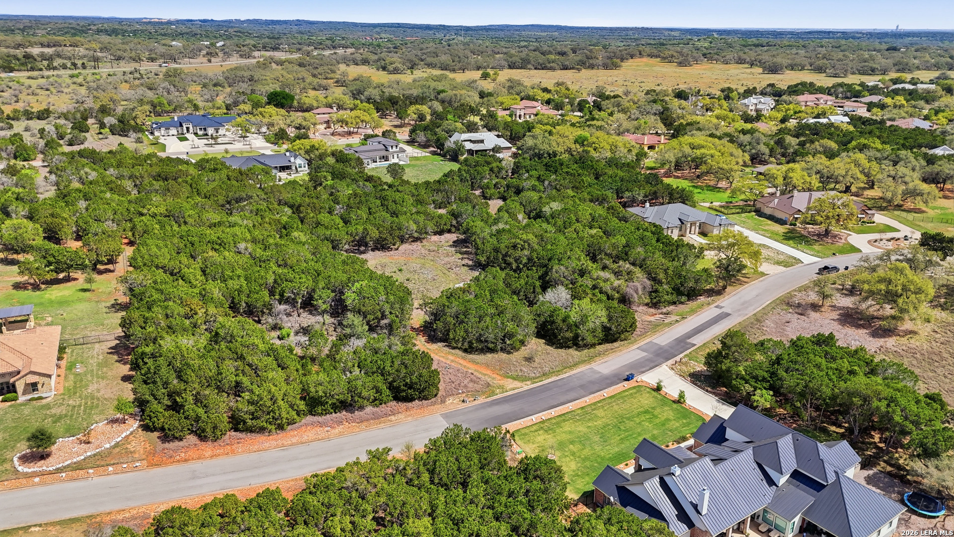 27230 Eichenbaum Road New Braunfels, TX 78132 - Photo 36 of 38 an aerial view of residential houses with outdoor space and trees