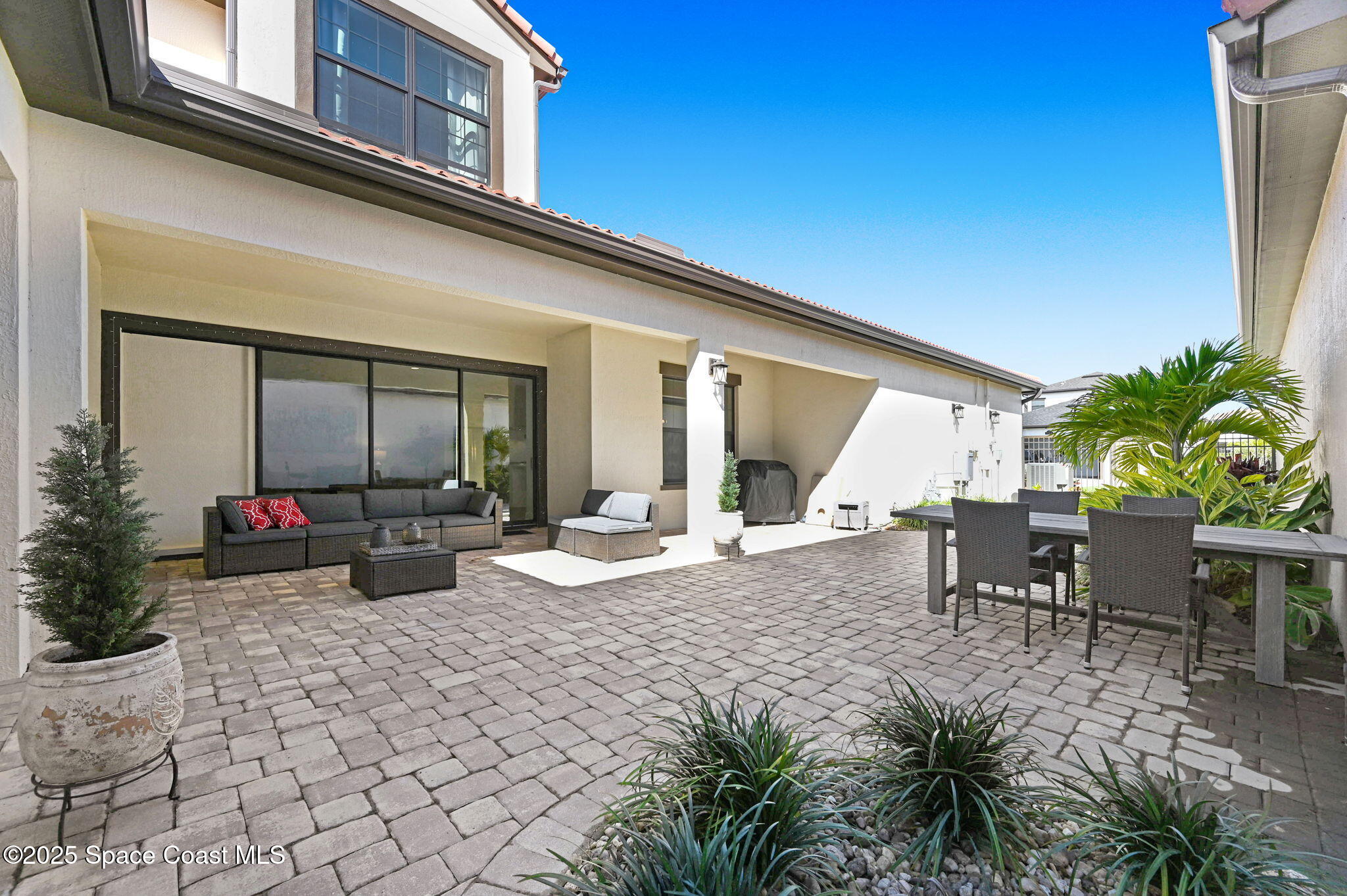 2366 Addison Drive Melbourne, FL 32940 - Photo 18 of 43 a view of a house with backyard sitting area and garden