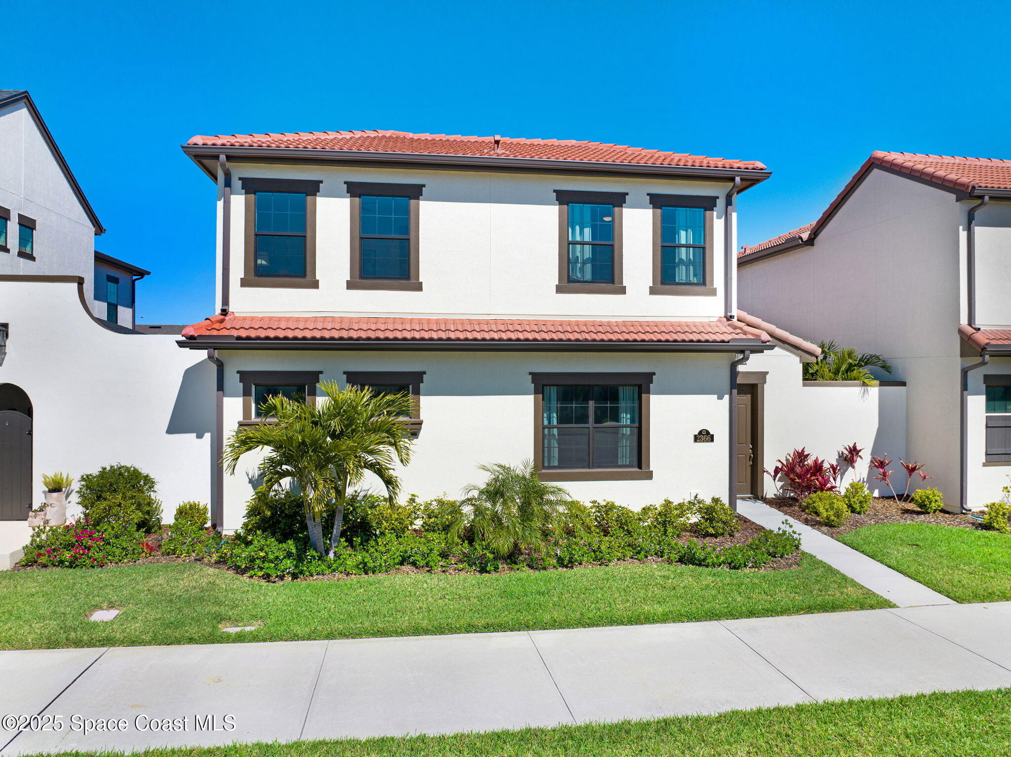2366 Addison Drive Melbourne, FL 32940 - Photo 2 of 43 a front view of a house with garden