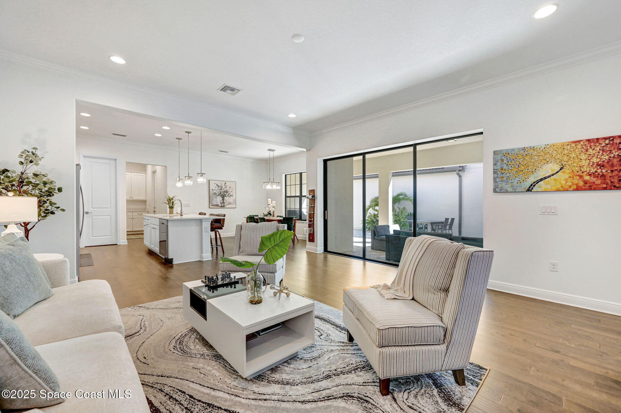 2366 Addison Drive Melbourne, FL 32940 - Photo 24 of 43 a living room with furniture and a table