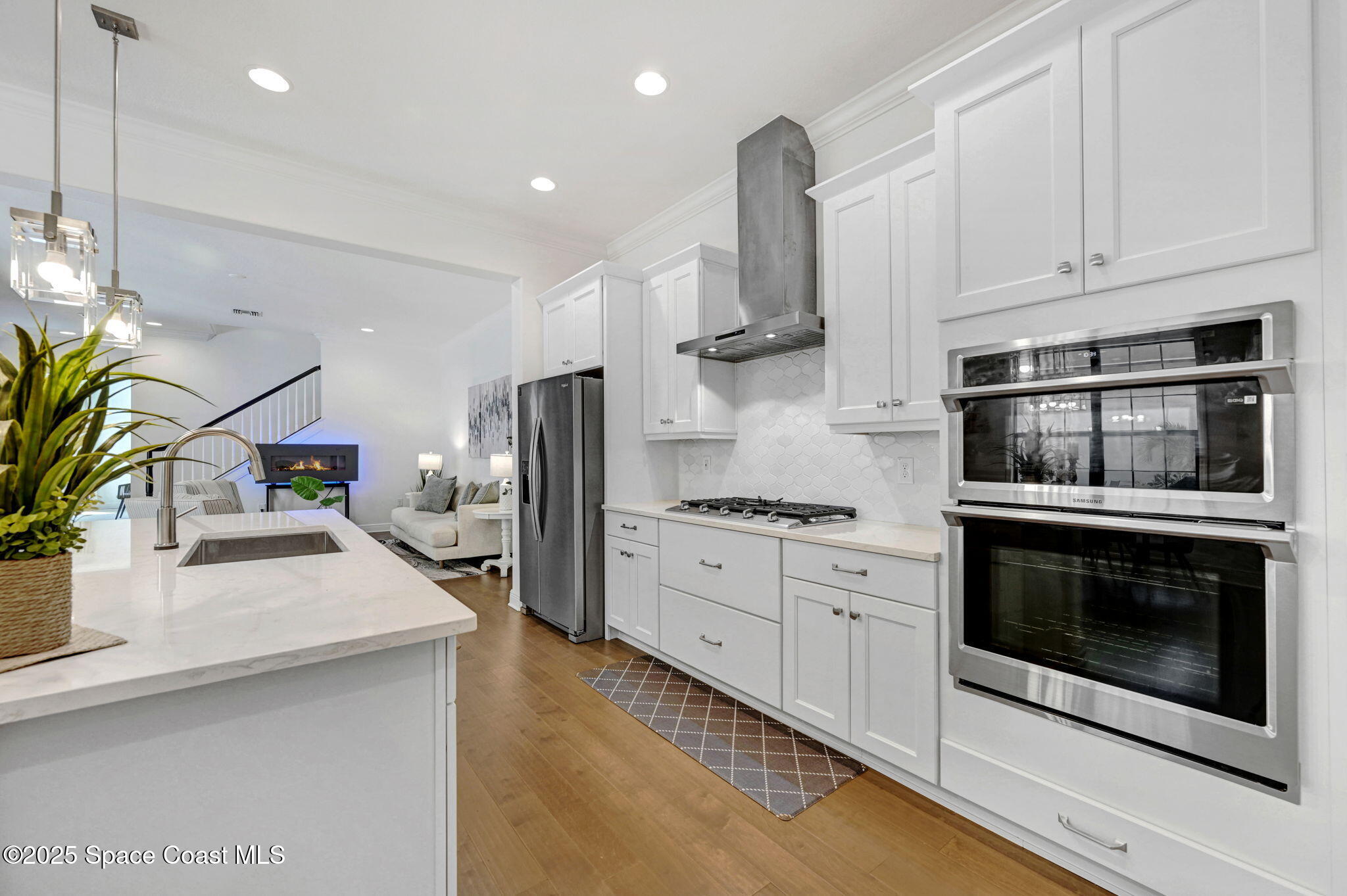 2366 Addison Drive Melbourne, FL 32940 - Photo 28 of 43 a kitchen with stainless steel appliances granite countertop a stove a sink and a microwave
