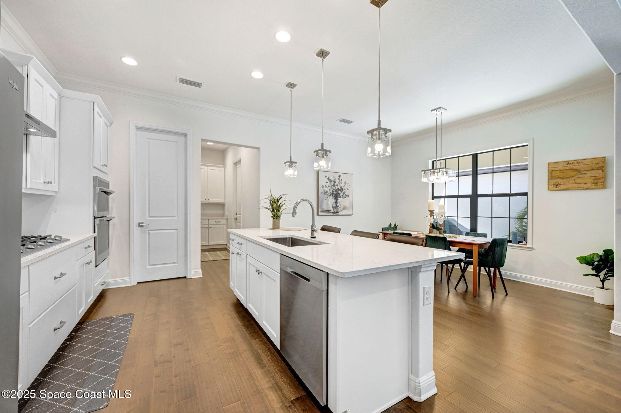 2366 Addison Drive Melbourne, FL 32940 - Photo 29 of 43 a large kitchen with kitchen island a sink a center island a stove and a center island
