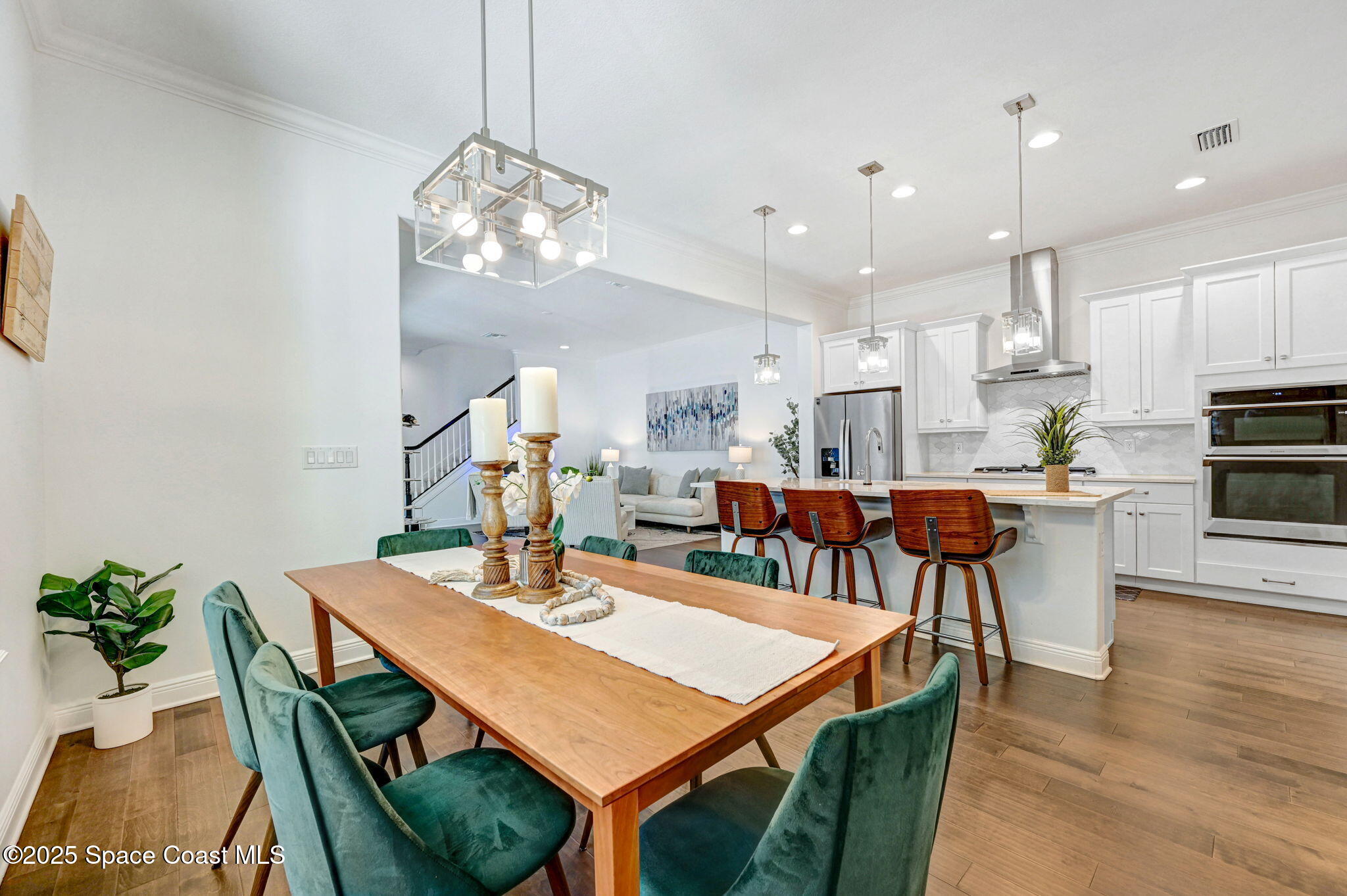2366 Addison Drive Melbourne, FL 32940 - Photo 30 of 43 a view of a dining room with furniture and wooden floor