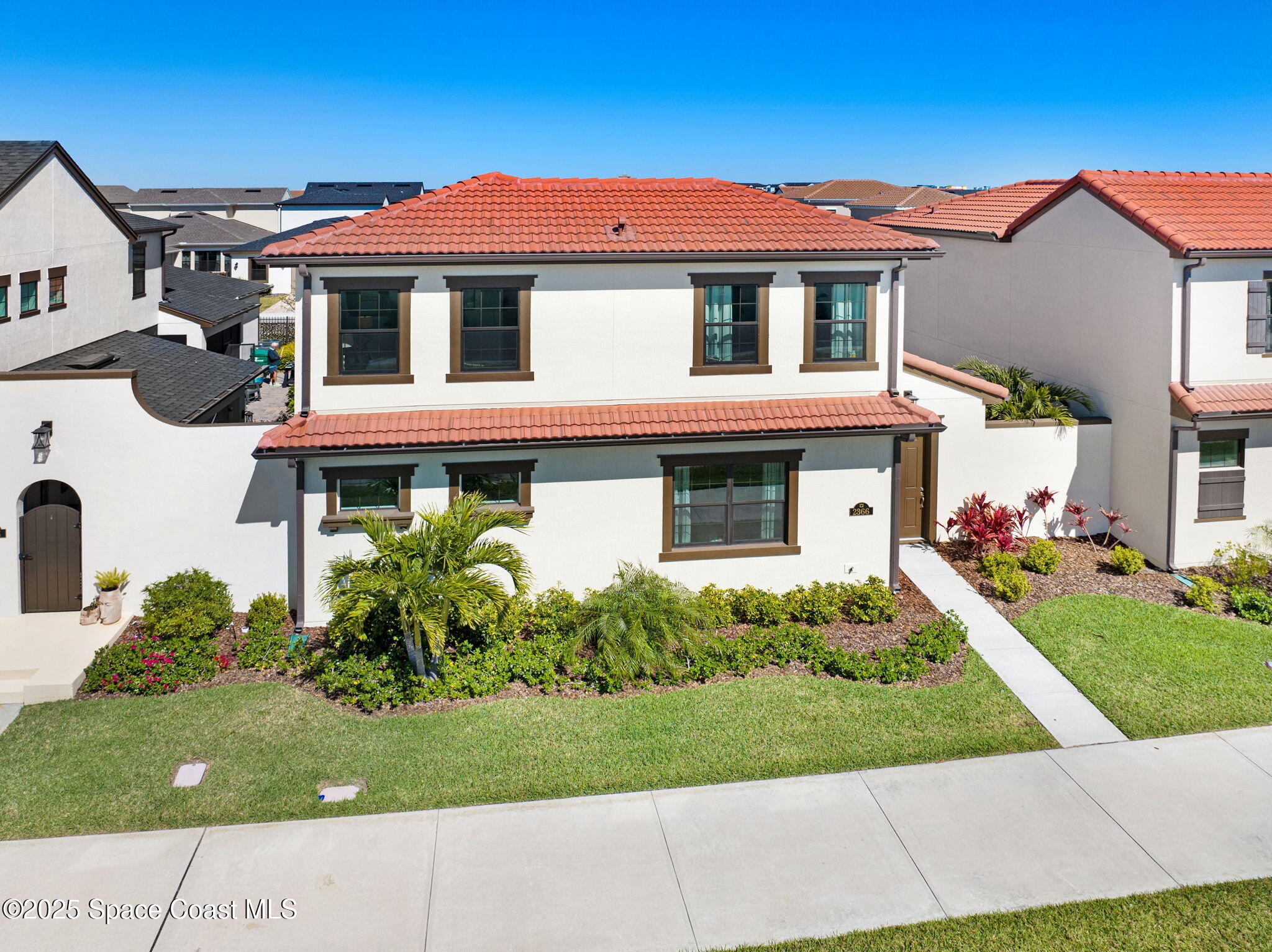 2366 Addison Drive Melbourne, FL 32940 - Photo 3 of 43 a front view of a house with a yard