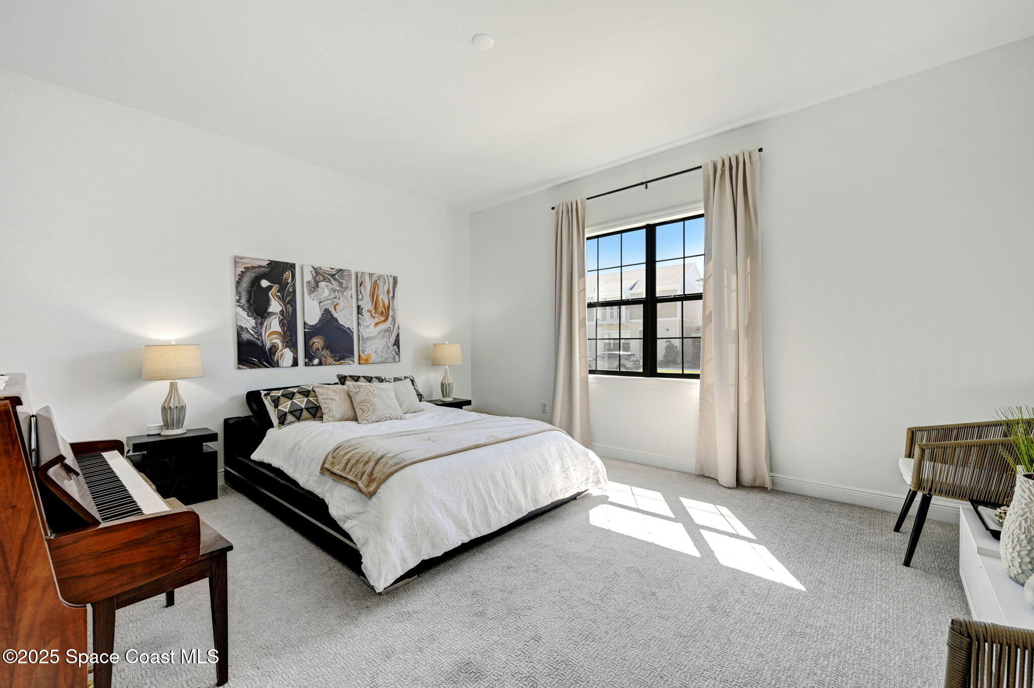 2366 Addison Drive Melbourne, FL 32940 - Photo 32 of 43 a bedroom with a bed and a window